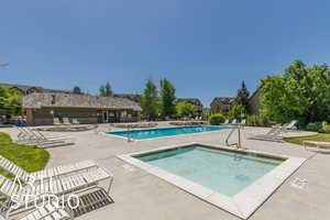 Community pool featuring a patio
