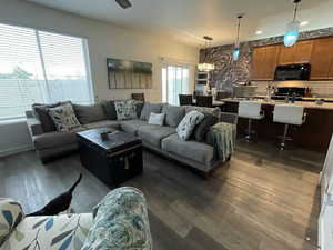 Living room featuring dark wood finished floors and recessed lighting