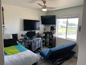 Bedroom featuring carpet and ceiling fan