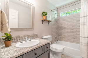 Recently remodeled bathroom with vanity and shower / bath combo