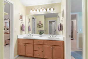 Jack and Jill bathroom featuring double vanity and shower