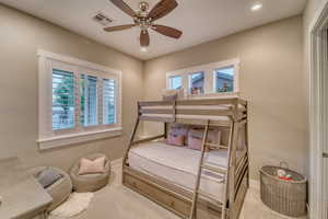 Carpeted bedroom with baseboards, recessed lighting, and ceiling fan