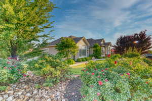 View of side of home featuring stucco siding