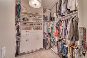 Spacious closet featuring carpet