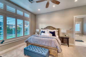 Carpeted bedroom with baseboards, recessed lighting, connected bathroom, and ceiling fan