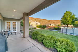 View of patio / terrace featuring a mountain view, french doors, and grilling area