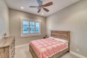 Bedroom with baseboards, light colored carpet, recessed lighting, and a ceiling fan