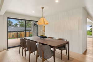 Dining area featuring light wood-style flooring and recessed lighting