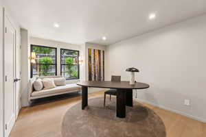 Office area featuring light wood-type flooring, recessed lighting, and baseboards
