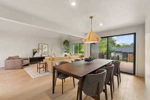 Dining room featuring light wood-style flooring and recessed lighting