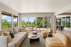 Living room featuring plenty of natural light, recessed lighting, and wood finished floors