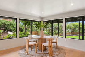 Dining space with plenty of natural light, baseboards, and recessed lighting