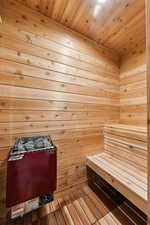Sauna / steam room with wood walls