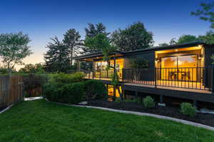 Back of house featuring a deck
