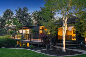 Rear view of house with a wooden deck