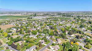 Aerial view of property and surrounding area with mountains