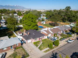 Aerial view of residential area featuring a mountainous background