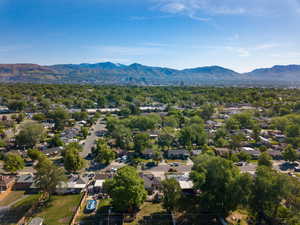 Aerial perspective of suburban area with a mountain backdrop