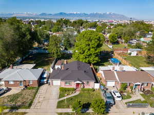 Aerial perspective of suburban area with a mountainous background