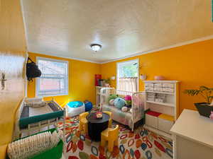 Bedroom featuring a textured ceiling