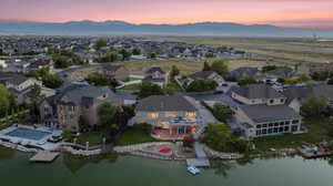 Aerial perspective of suburban area featuring a water and mountain view