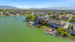 Aerial perspective of suburban area with a water and mountain view