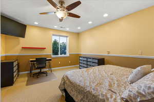 Bedroom featuring carpet flooring, baseboards, recessed lighting, a desk, and ceiling fan