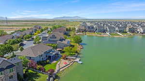 Aerial perspective of suburban area with a water and mountain view