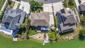 Aerial perspective of suburban area with a large body of water