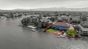 Aerial perspective of suburban area featuring property parcel outlined and a water and mountain view