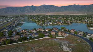 Aerial view at dusk of a water and mountain view and a residential view