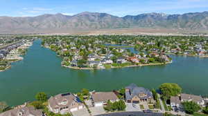 Aerial view of residential area featuring a water and mountain view