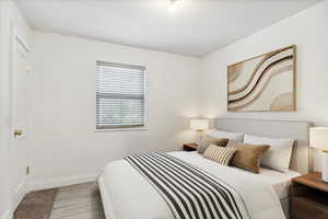 Staged Bedroom, Carpeted featuring colonial baseboards