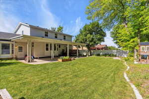 Back of house featuring a patio area and back yard