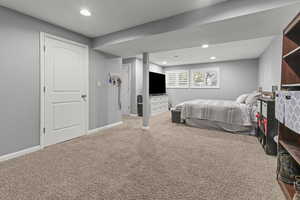 Bedroom featuring carpet flooring and plenty of natural light