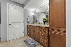 Bathroom featuring vanity, walk-in shower, and heated flooring.