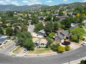 Aerial perspective of suburban area featuring a mountain backdrop