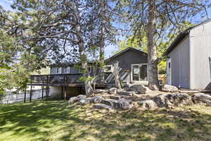 Rear view of property with a wooden deck
