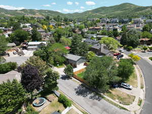 Aerial view of residential area featuring a mountainous background