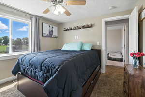 Bedroom with carpet flooring and a ceiling fan