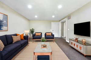Virtually Staged Photo: Living area featuring recessed lighting and baseboards