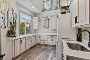 Laundry Room with it's own loft, sink, and ample amount of cabinet space.