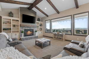 Vaulted ceilings with exposed wood beams. Lovely gas fireplace. Views Views Views.