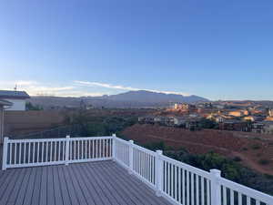 Wooden terrace featuring a mountain view