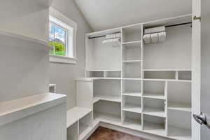 Master Walk in closet with lofted ceiling