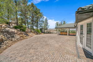 View of patio / terrace featuring a hot tub