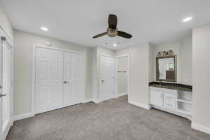Unfurnished bedroom featuring light colored carpet, baseboards, recessed lighting, and ceiling fan