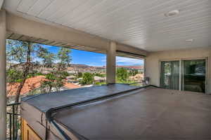 View of patio featuring a hot tub