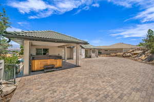 View of patio featuring a hot tub