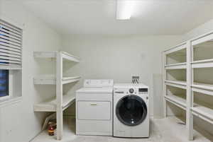 Laundry room with washing machine and dryer